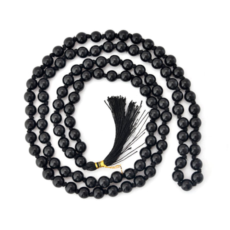 Black beaded mala necklace with tassel for meditation, healing, and spiritual practice