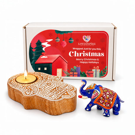 Hand carved wooden hamsa shaped tealight candle holder with intricate white patterns in festive keepsake box gift hamper