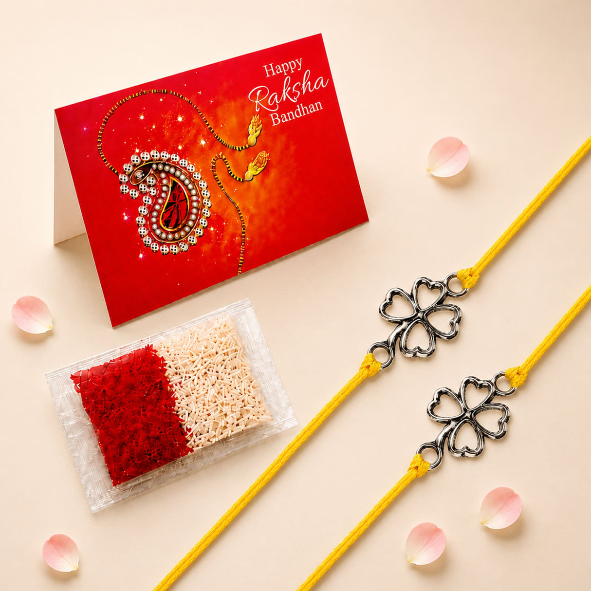 Two yellow rakhi bracelets with silver four-leaf clover charms traditional raksha bandhan protection jewelry gift