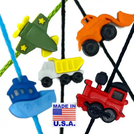 Collection of colorful toy vehicles on strings, including planes, cars, and trucks, labeled ’MADE IN U.S.A.’