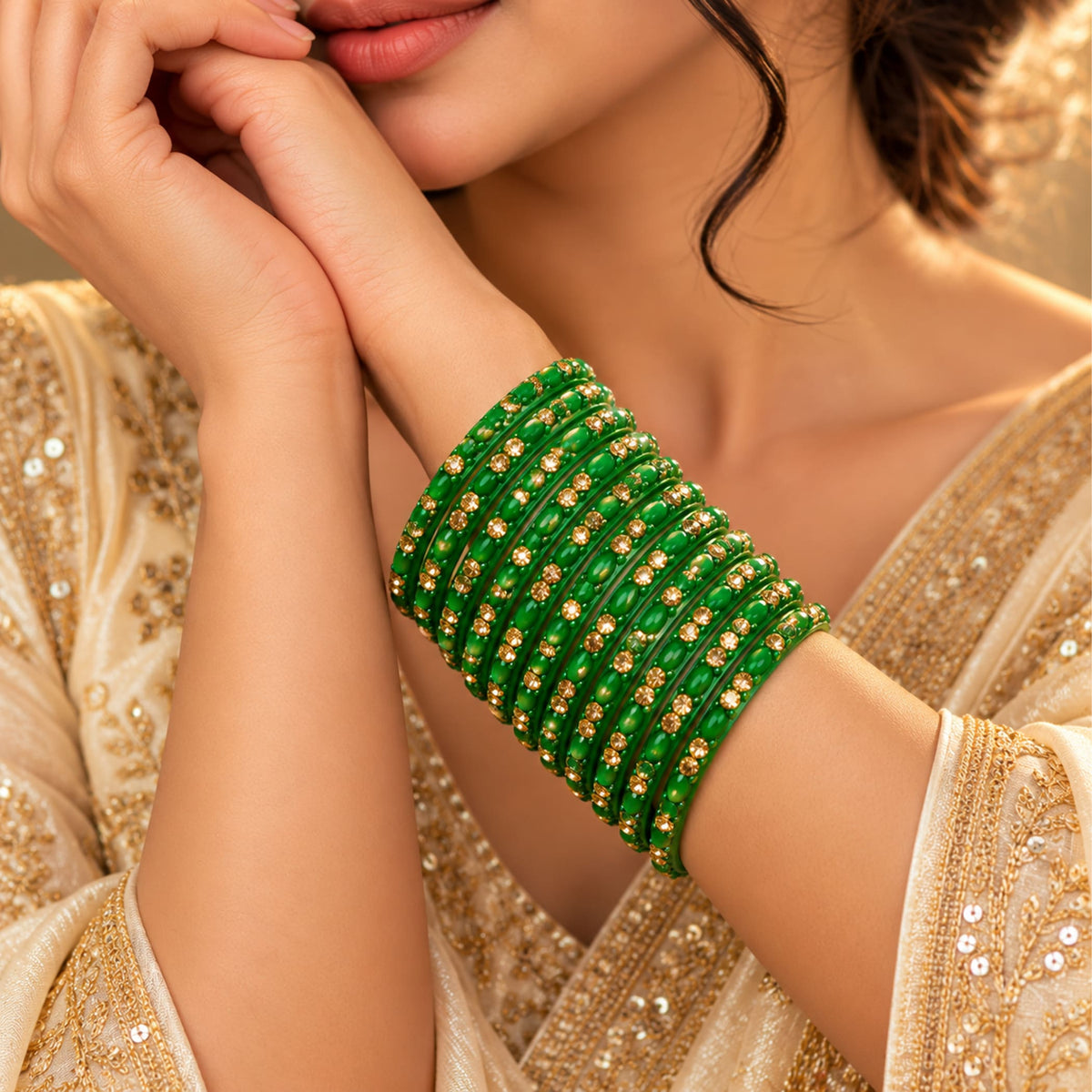 A stack of vibrant green 12ct glass bangles with gold-colored embellishments perfect for bridal and wedding gifting