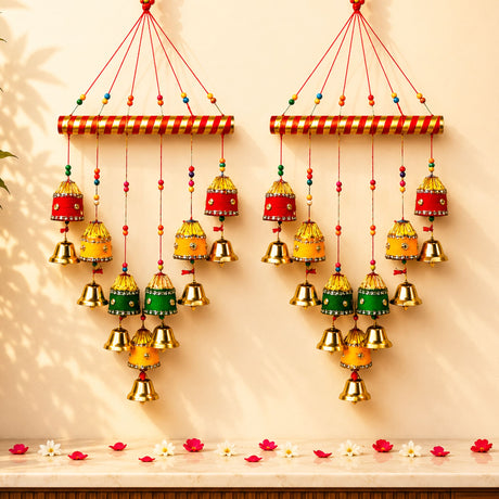 Two Indian wind chimes with red and gold striped tops and colorful bells for home wall and outdoor decor