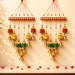 Two Indian wind chimes with red and gold striped tops and colorful bells for home wall and outdoor decor