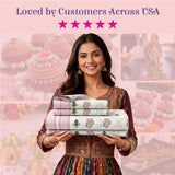 Woman in embroidered dress holds 100% cotton Indian block printed floral sheets