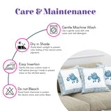 White cotton pillow cover with blue elephant embroidery and border