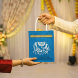 Blue jute tote bag with white embroidered elephant design and gold trim eco friendly reusable indian wedding favor bag