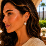 Delicate silver star-shaped dangle earrings with sparkling faceted design and white crystal teardrop leverback for women