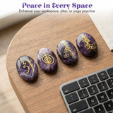 Four polished purple amethyst crystal reiki stones engraved with golden mystical symbols for chakra balancing and meditation