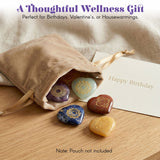 Set of five heart-shaped crystal reiki stones with golden chakra symbols in purple green blue brown and yellow gemstones