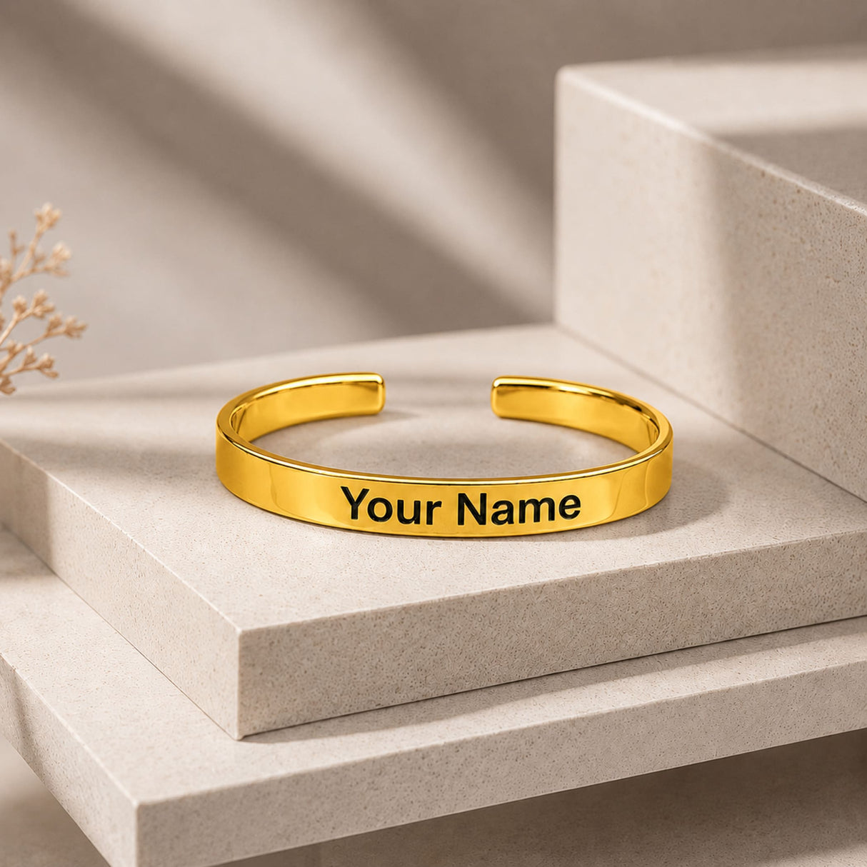 Gold-colored personalized custom name cuff bracelet with smooth metallic finish and engraved text your name