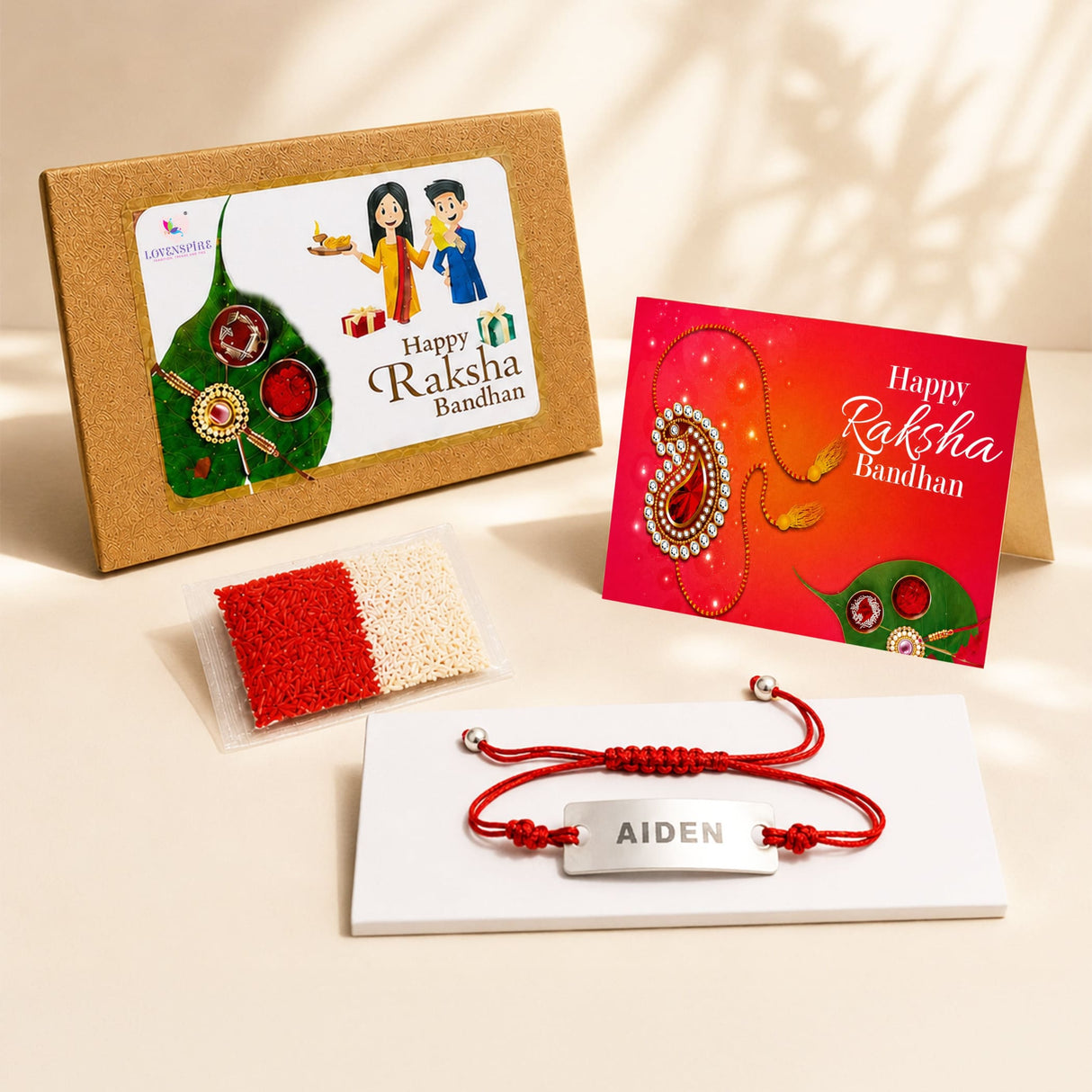 Personalized stainless steel name rakhi with red braided cord and silver plate engraved with aiden for raksha bandhan gift