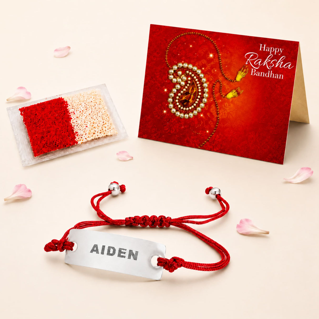 Personalized stainless steel name rakhi bracelet with red braided cord and engraved silver plate for brother gift hamper