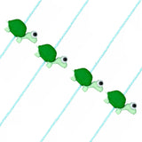 Green clay turtle charm with black and white googly eyes strung on light blue cord cartoon animal rakhi bracelet