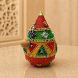 Shriphal mangal kalash decorated coconut featuring a vibrant beaded pot with colorful geometric patterns for wedding pooja