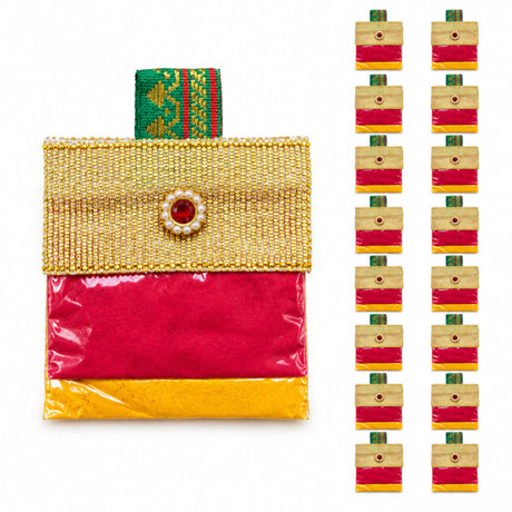 Decorative handbag style mini haldi kumkum packets with gold and pink beads and green patterned accents for pooja thali
