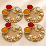 Gold-colored decorative haldi kumkum thali holder with pearl embellishments and bowls for pooja powders