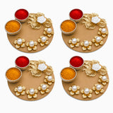 Gold-colored decorative haldi kumkum thali holder with intricate floral designs pearl accents and three small bowls for puja powders