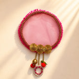 Designer and decorative karwachauth channi pink fringed circular fan with gold embellishments and dangling ornaments