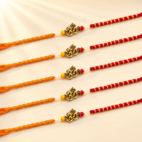 Five traditional orange and red handcrafted designer om rakhi bracelets with golden om charms white pearls and yellow beads for raksha bandhan