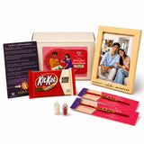 Red kitkat king size chocolate bar with gold and white branding in designer rakhi gift hamper for brother and bhabhi