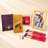 Designer Rakhi Gift Hamper for Brother & Bhabhi – Adjustable Rakhi Bracelet with Photo Frame, Chocolates, Roli Chawal & Card for Raksha Bandhan