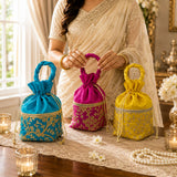 Traditional Indian ethnic zari potli bags for women featuring vibrant turquoise magenta and yellow embroidery with gold thread detailing