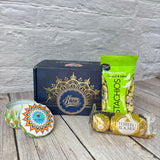 Dark blue Diwali gift box with gold Happy Diwali script and intricate gold mandala design