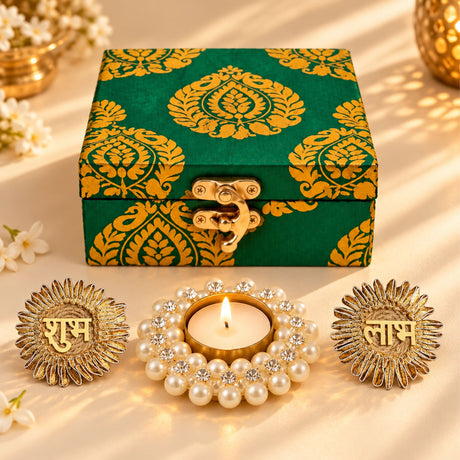 Diwali gift hamper with green and gold brocade box with brass latch and candle holder for festive celebration and gifting
