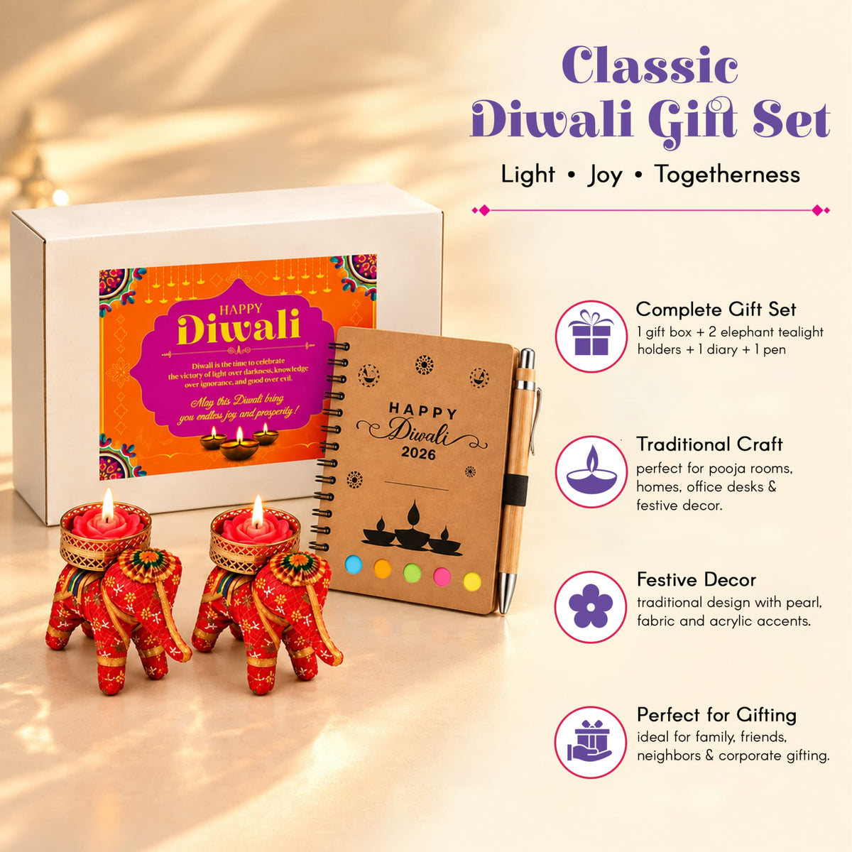 Red elephant-shaped tealight holders with intricate gold and green embroidery in a diwali gift hamper set