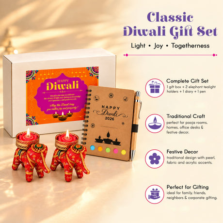 Red elephant-shaped tealight holders with intricate gold and green embroidery in a diwali gift hamper set