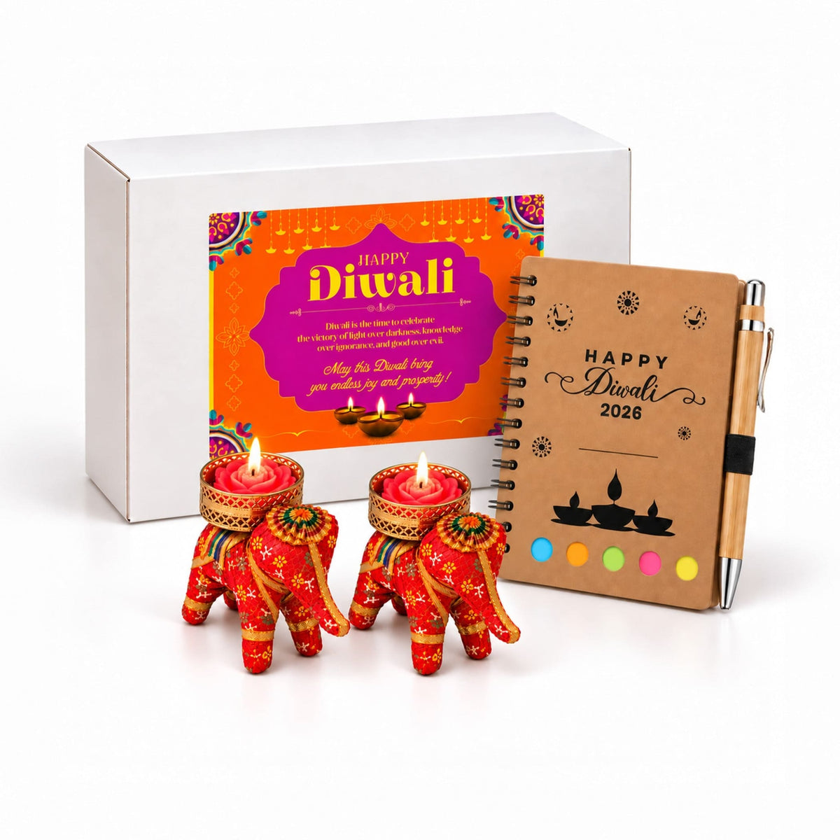 Two red elephant-shaped tealight candle holders with gold and green decorative patterns for diwali gift hamper