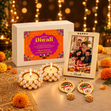 Pearl-encrusted gold-colored diwali diya holders with lit tealight candles in festive gift hamper set