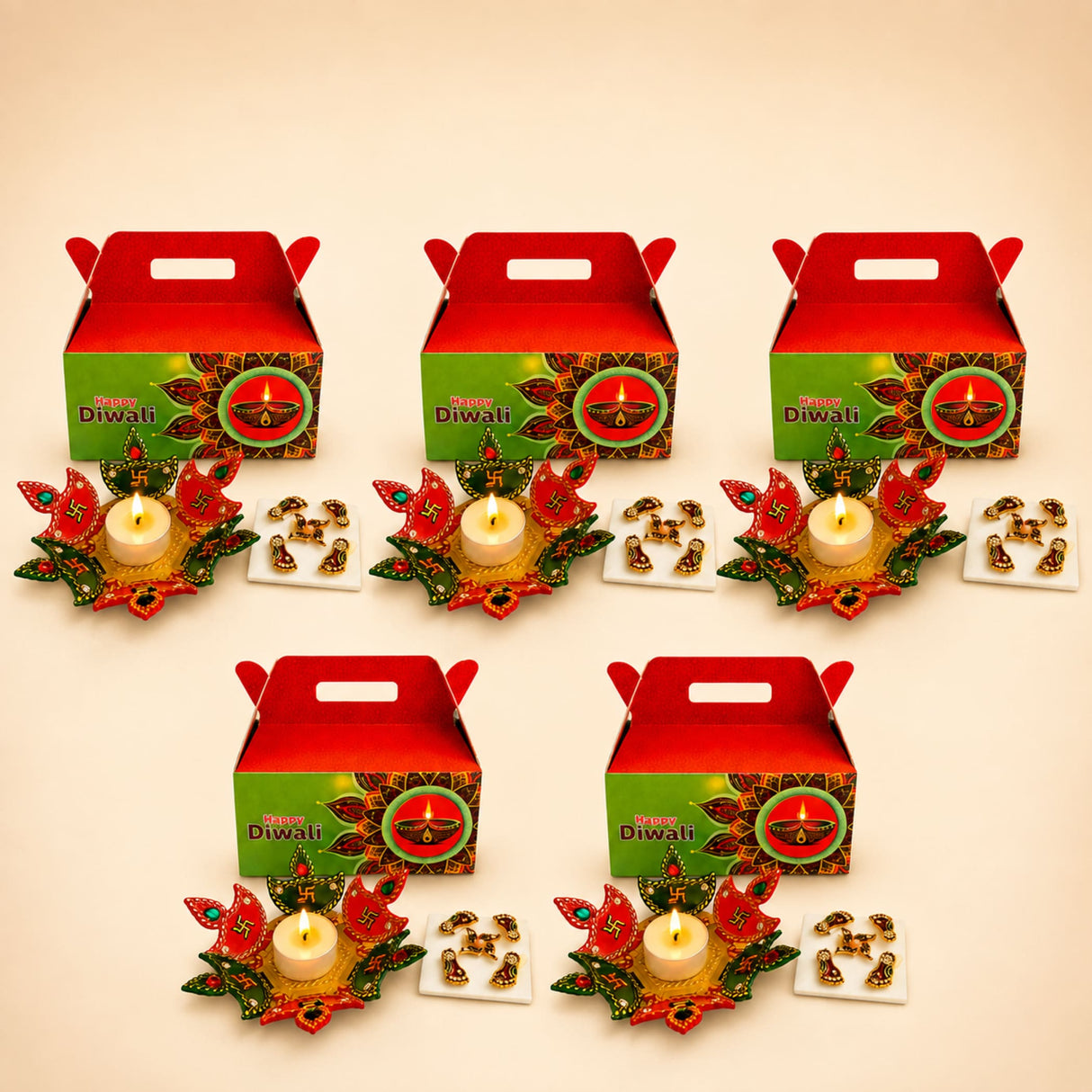 Diwali gift hamper featuring red and green happy diwali themed gable boxes with acrylic rangoli set and floral candle holders