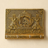 Golden brass decorative indian doli wall-mounted key holder with intricate engraved musicians and four hooks for home use