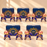 Blue elephant-shaped diwali oil lamps with gold accents and rainbow stripes in handmade indian festival gift hamper