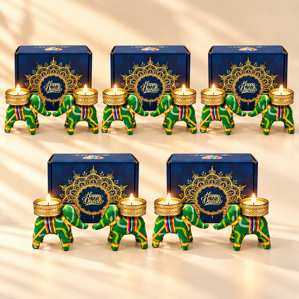 Green and gold elephant-shaped Diwali candle holders with colorful striped accents for festive home and office décor