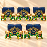 Green and gold elephant-shaped Diwali candle holders with colorful striped accents for festive home and office décor