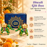 Green elephant-shaped candle holders with gold accents and colorful striped trims for diwali gift hampers
