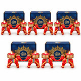 Red elephant-shaped diwali candle holders with gold accents and decorative patterns for festive gift hampers