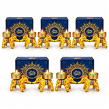 Yellow elephant-shaped Diwali candle holders with floral patterns and gold accents holding lit green tea lights