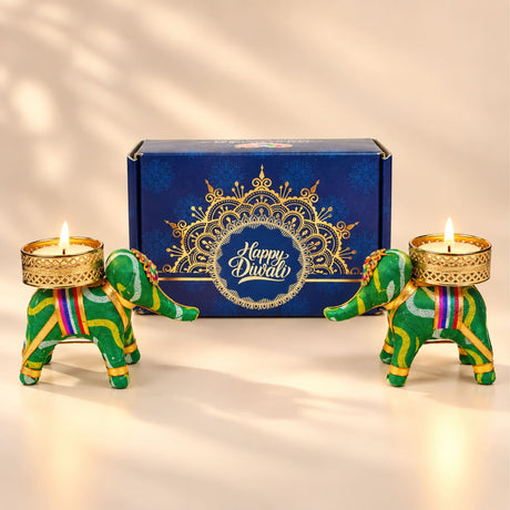 Green elephant-shaped candle holders with gold-trimmed bases and colorful stripes for diwali gift hampers