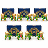 Green and gold elephant-shaped diwali candle holders with colorful striped accents for festive gift hampers