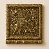 Golden ornate wall-mounted key holder with intricately engraved elephant and floral scrollwork for home decor and organization