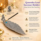 Antique german silver leaf-shaped incense holder with intricate ganesha detailing and blue gemstone for pooja room use