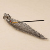 Silver elephant-themed incense holder with intricate floral engravings and red gemstone accent for housewarming gift