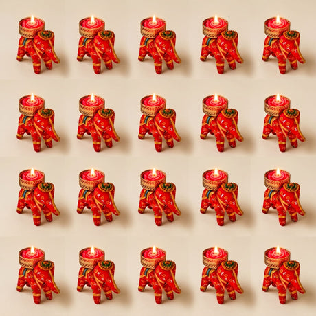Red elephant-shaped tea light candle holders with gold and green embroidered details for festive home decor