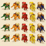 Colorful elephant-shaped tea light candle holders with intricate painted designs and golden accents for festive decor