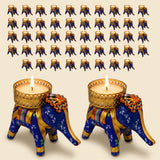 Blue and gold elephant tea light candle holders with intricate patterns and decorative fabric accents for festive decor