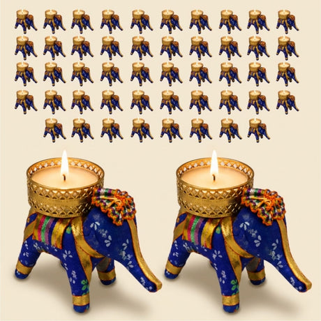 Blue and gold elephant tea light candle holders with intricate patterns and decorative fabric accents for festive decor