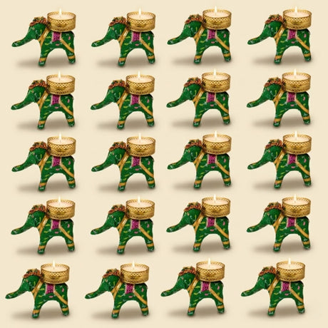 Green elephant-shaped tealight holders with gold and purple decorative accents for festive home decor and gifting